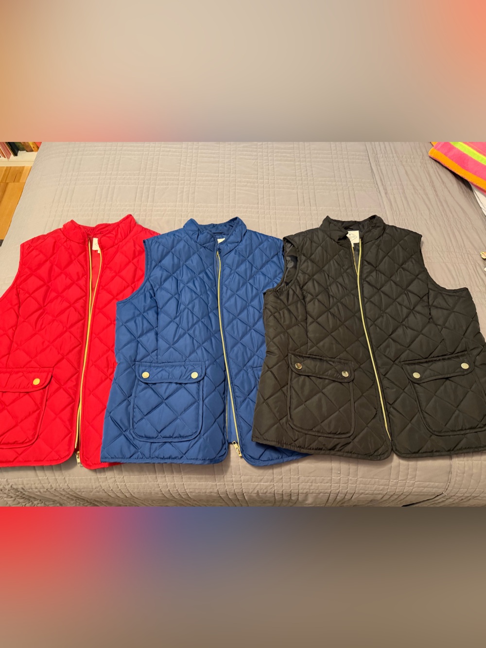 St. John's Bay Quilted Puffer Vests in Black, Blue, and Red
